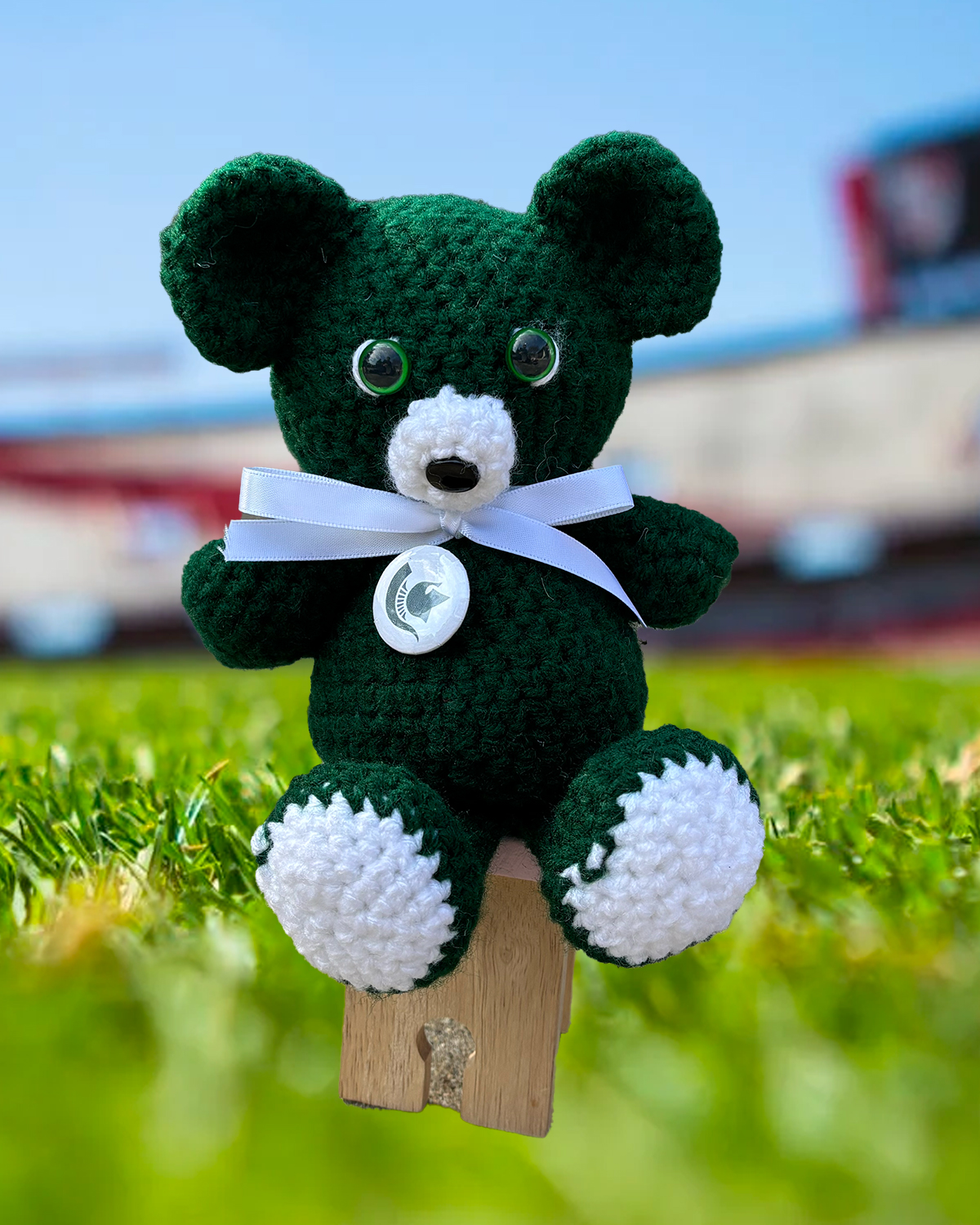 Michigan State crochet bear in green and white with white ribbon